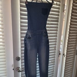 Overalls Brand new and never worn. Backless , tied up. Tight fitting.